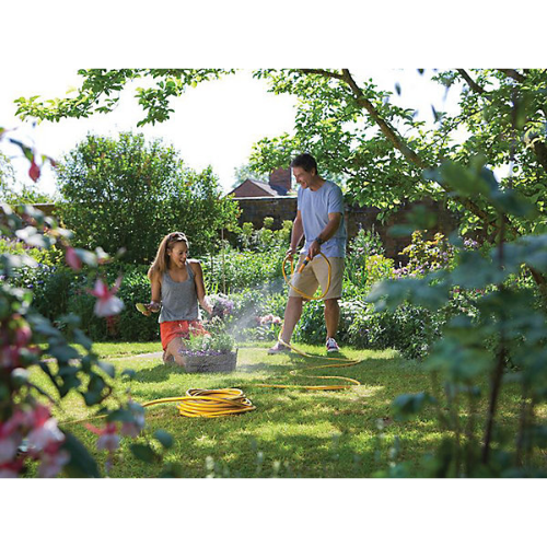 Image of a man and women using  Hozelock 7250 Diameter: 12.5mm (1/2 inch) Length: 50 metres to water plants [Davies DIY & Builders Merchants]